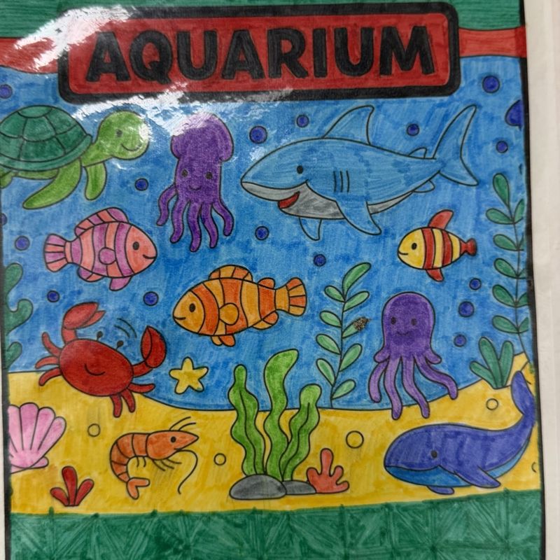 An aquarium scene painted with tropical fish, a seahorse, and a crab