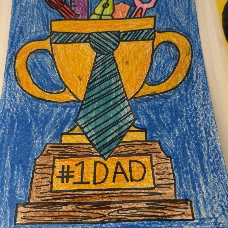 A hand-painted number one dad trophy with a necktie, made as a gift