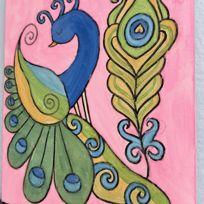 A painted peacock with sweeping green and blue tail feathers on a pink canvas, made in our art class