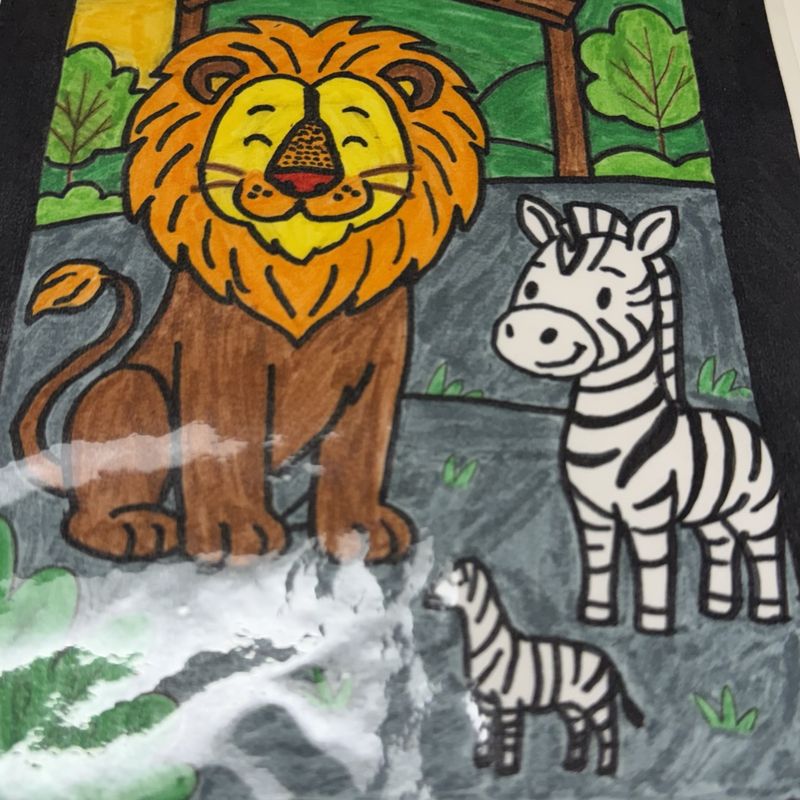 A lion and zebra painted at the zoo gates in bold greens and yellows