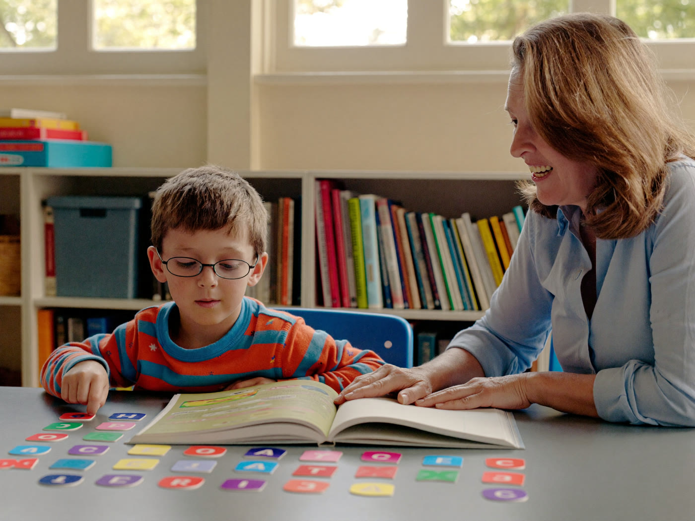 Children reading and working on writing together in a small-group reading class in Glendale
