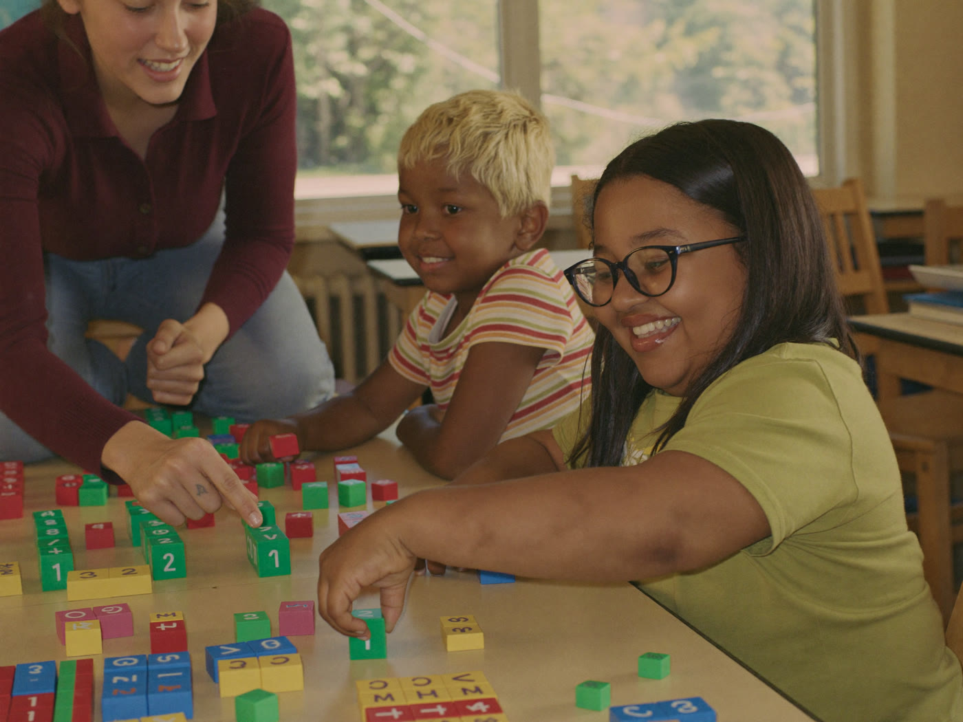 Child working through a hands-on math activity at the Glendale center