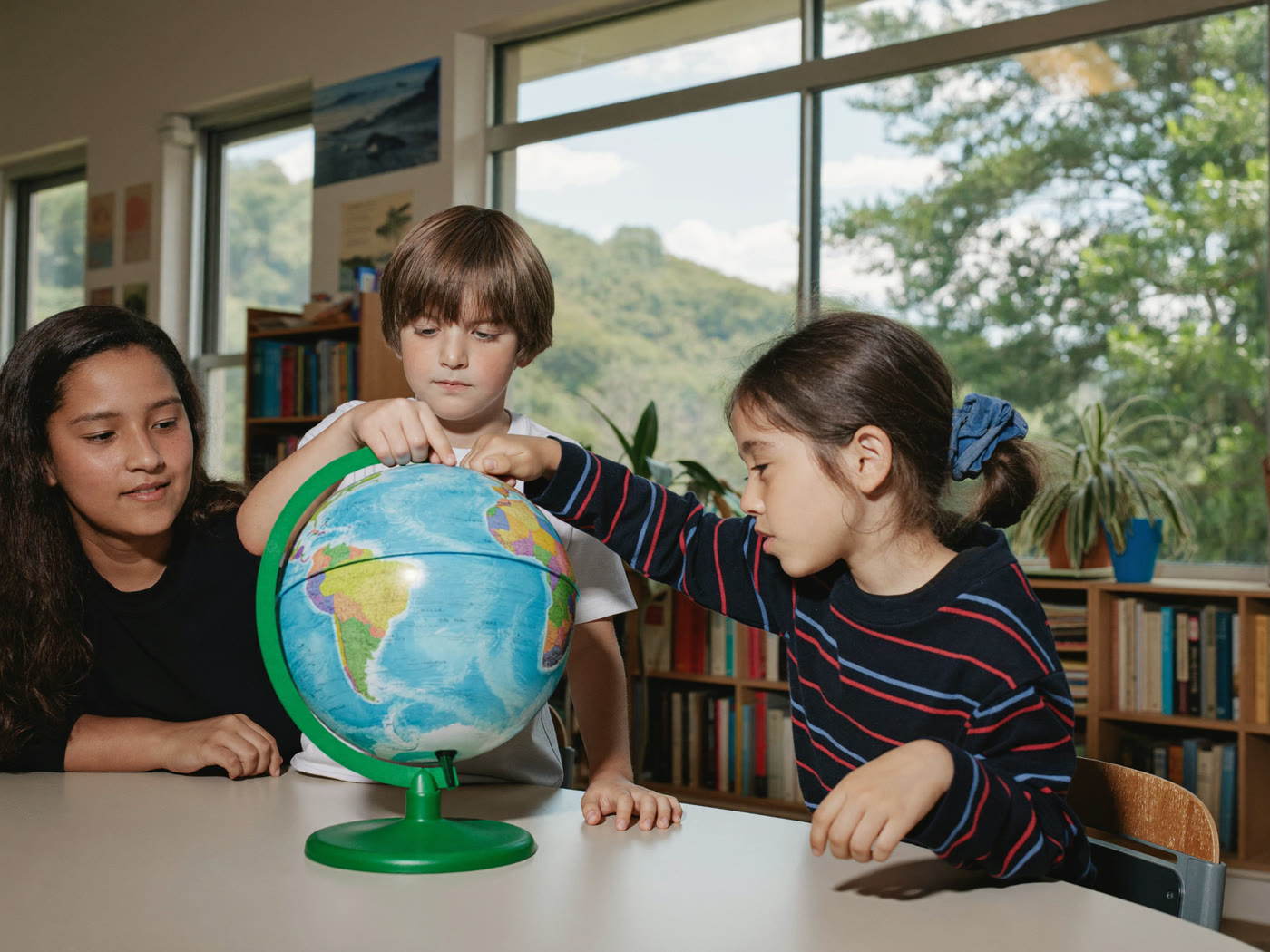 Children exploring world history together in a small-group history class in Glendale