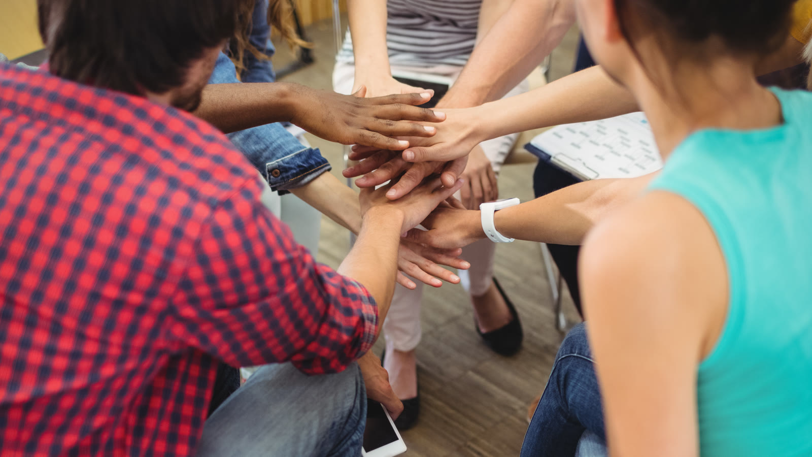 Hands coming together during a group activity