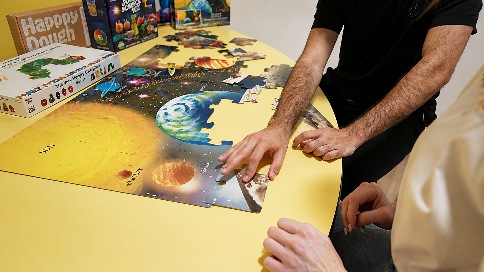 Participants completing a hands-on puzzle activity in Van Nuys