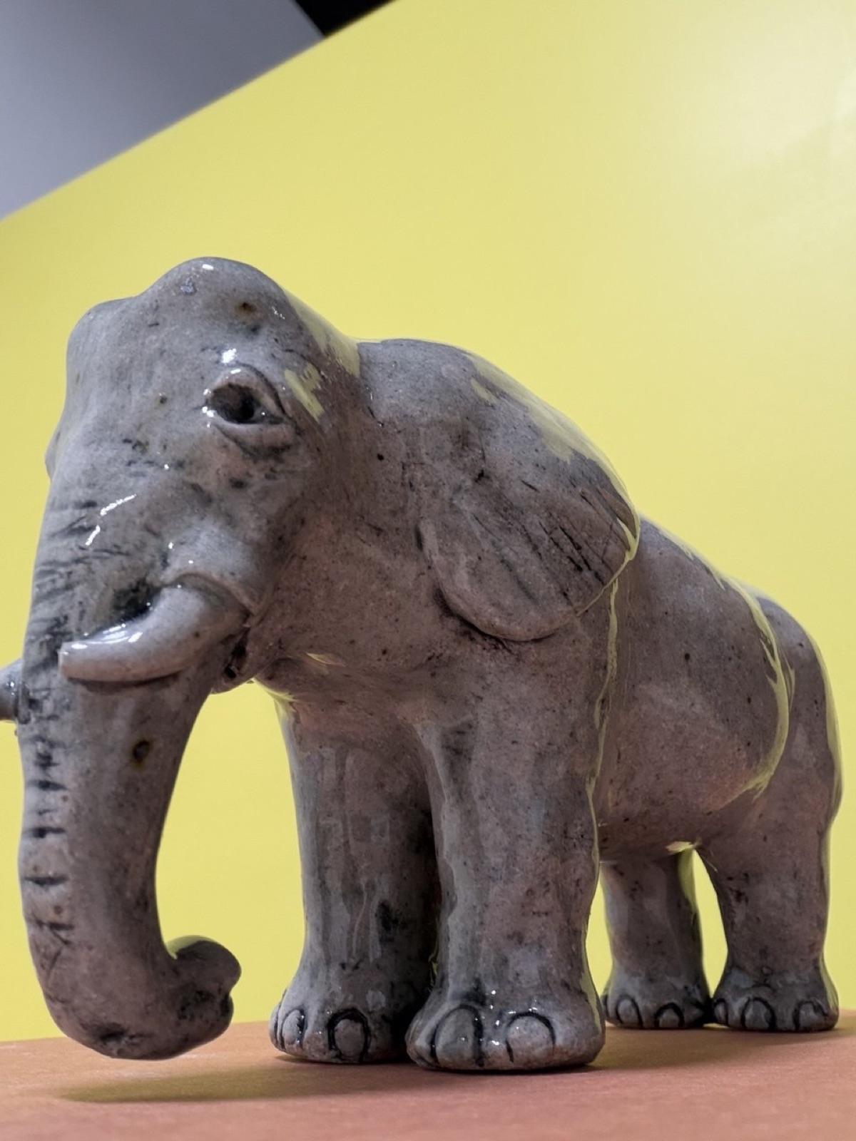 Close-up of a hand-sculpted and painted clay elephant