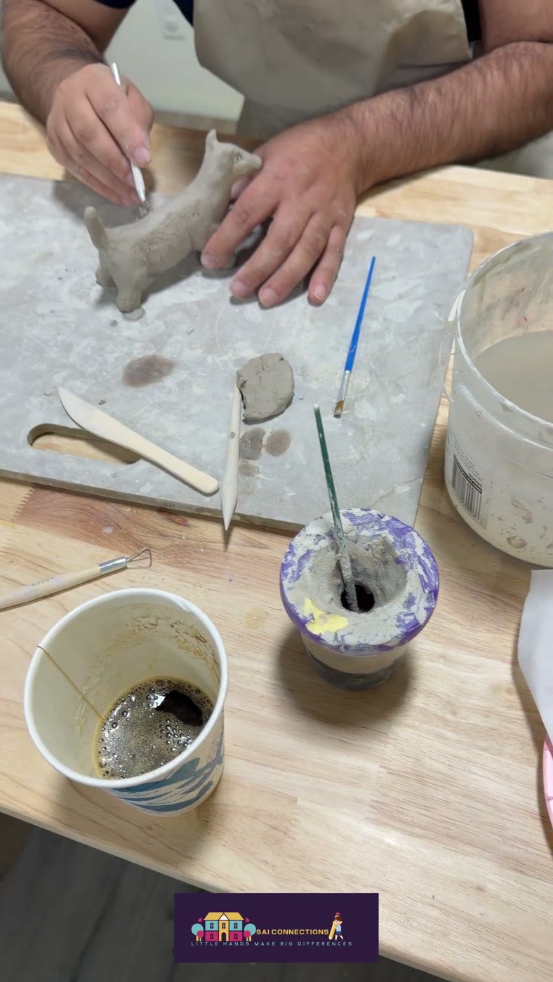Smoothing and painting clay details — hands-on pottery, Van Nuys