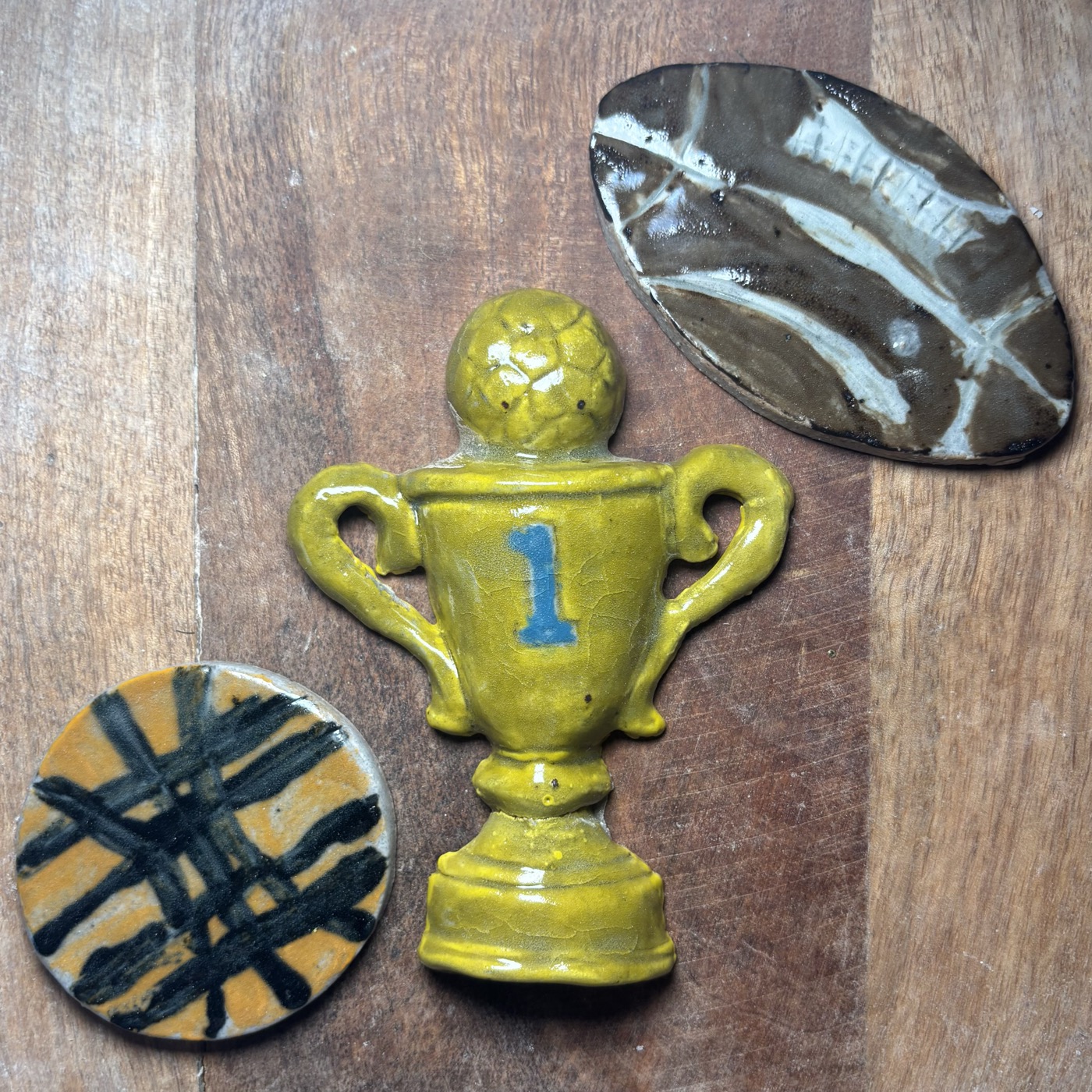 A number-one trophy shaped from clay by a young artist