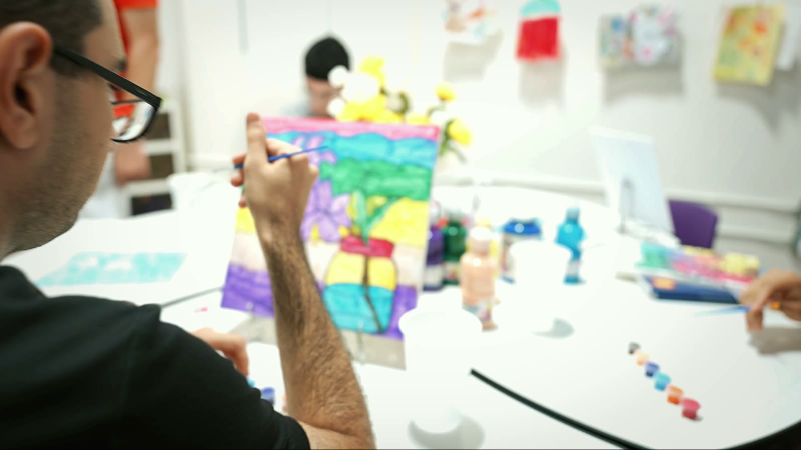 Adults creating in the Van Nuys art room