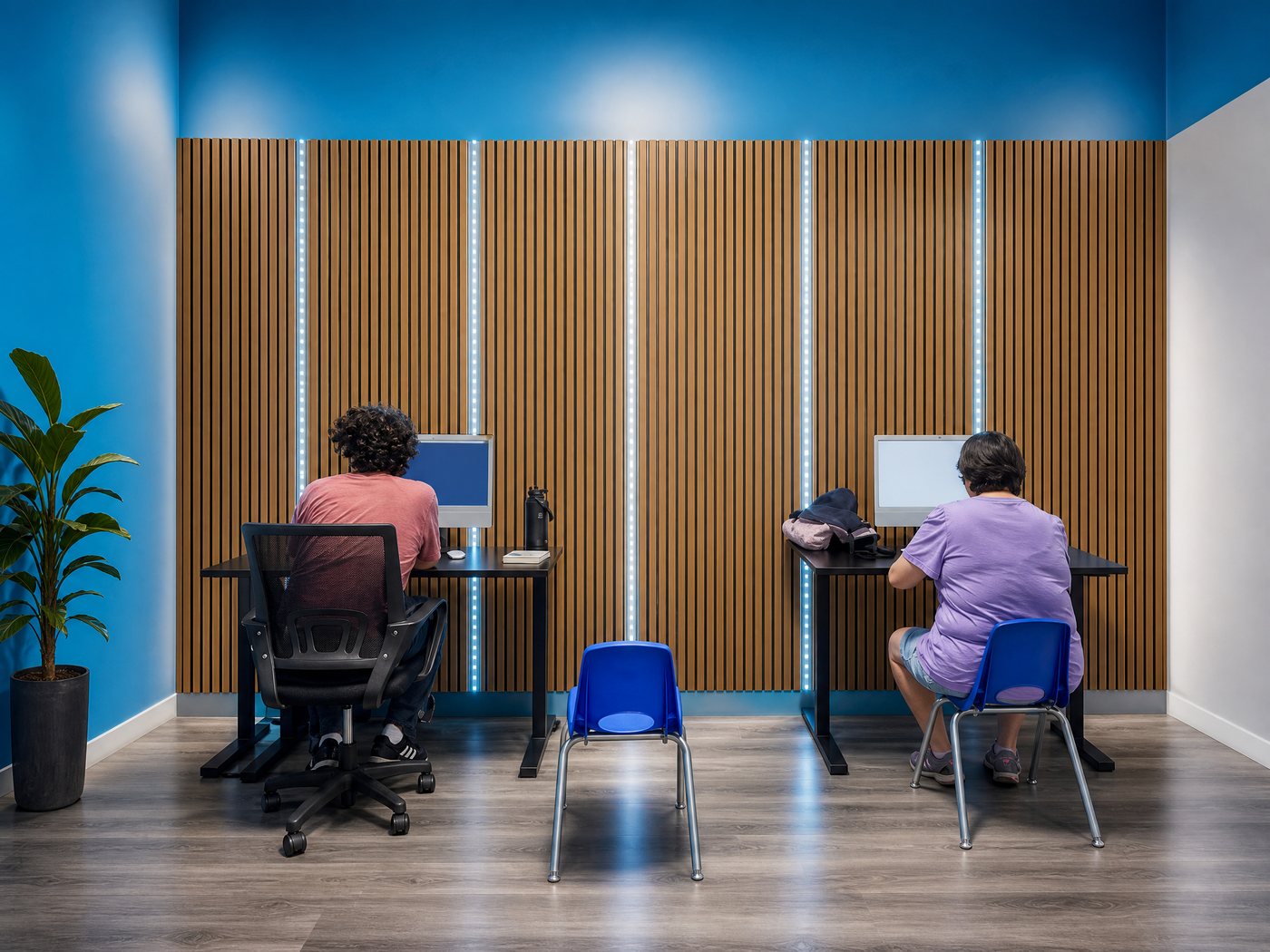 Adults working on computers learning AI, animation and 3D printing in Van Nuys