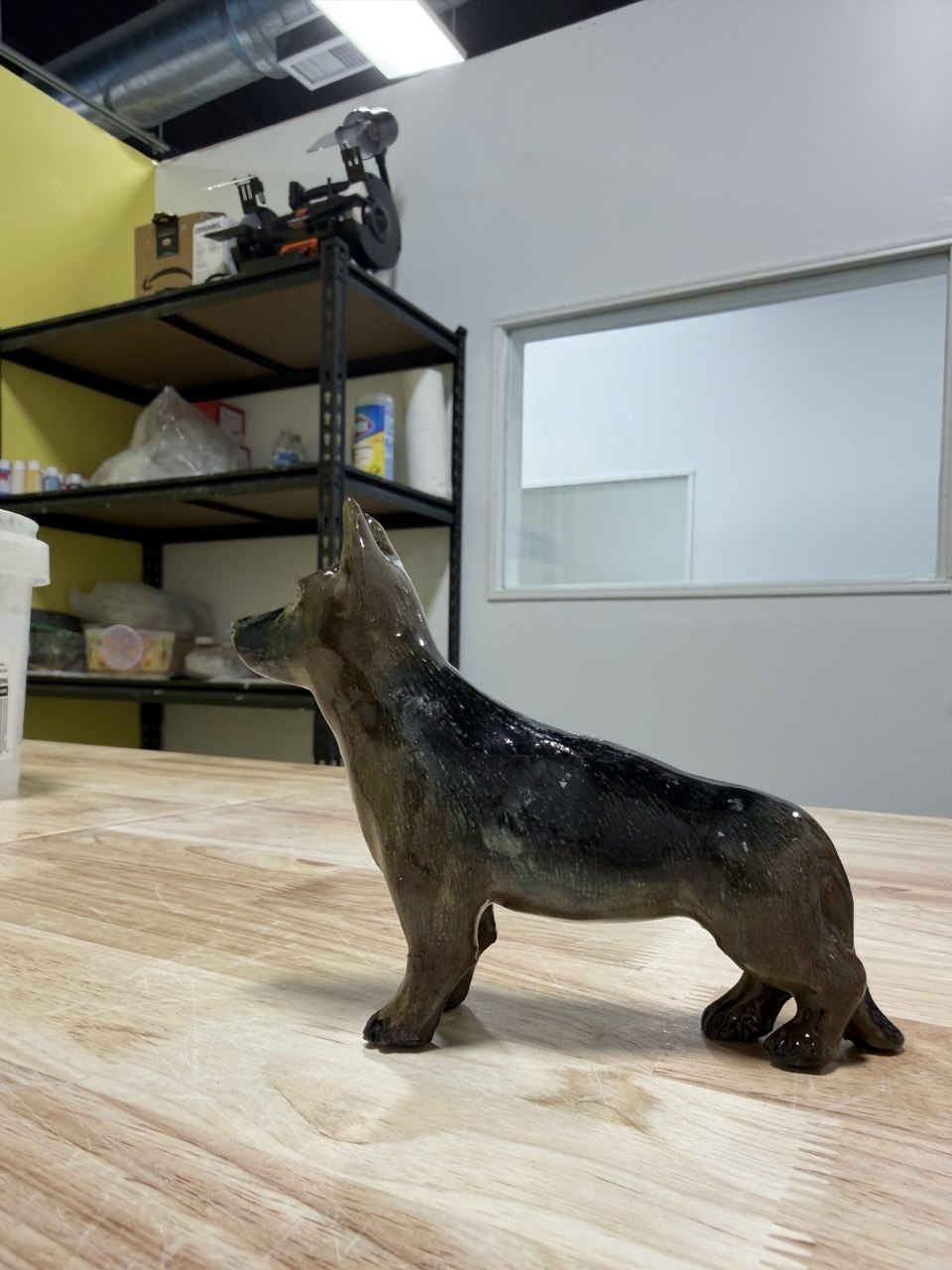 Finished clay dog sculpture made in the Van Nuys pottery studio